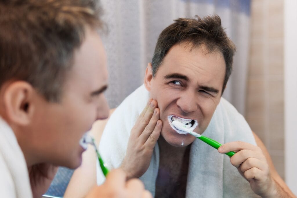 Emergency Dentist in Norwich examining bleeding gums during dental check-up
