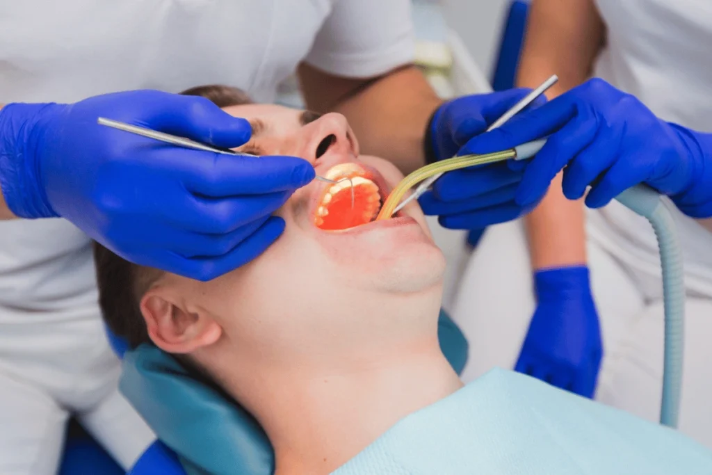 Dentist performing root canal treatment for a patient in Norwich clinic