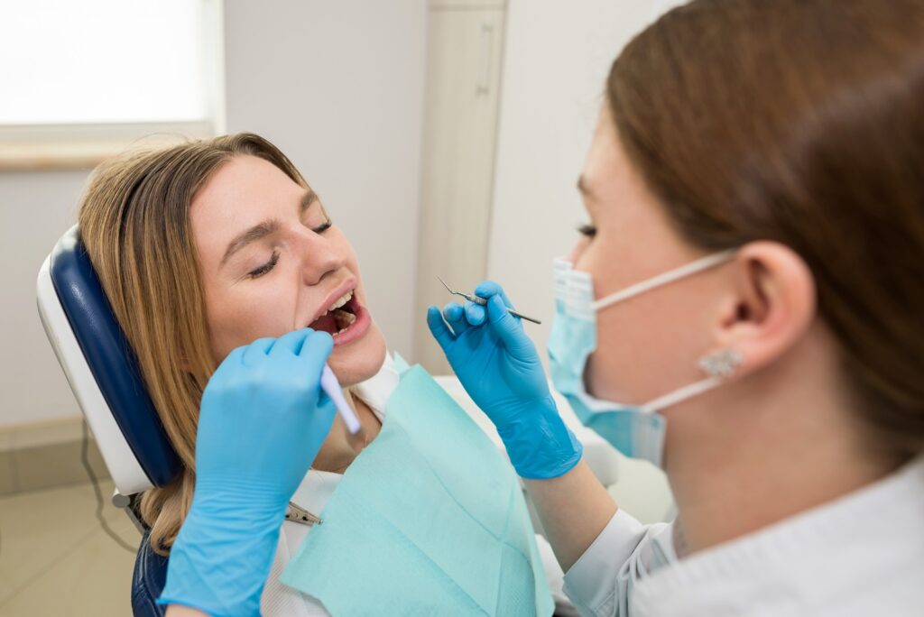 Patient discussing missing tooth replacement options with a dentist in Norwich